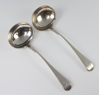 A pair of George III silver sauce ladles with engraved monogram London 1812, 88 grams 
