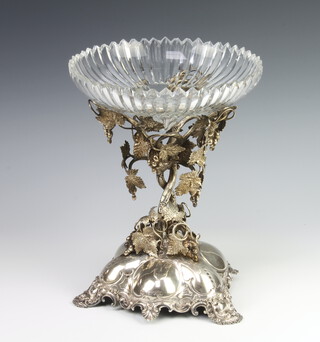 A Victorian silver table centrepiece with vinous stem and rococo base bearing a crest, London 1859, 864 grams, 27cm with a cut glass bowl (a/f)
