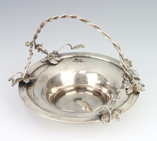 An 800 standard silver circular dish with foliate handle 200 grams, 17cm 