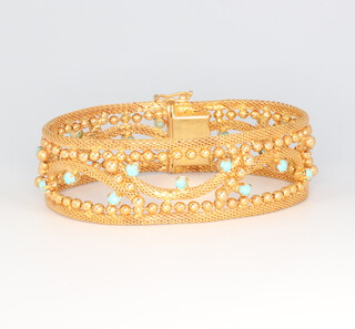 A yellow metal stamped 750, turquoise set and open mesh bracelet, 39 grams gross, 18cm 