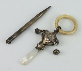 A silver, mother of pearl and bone teether rattle Chester 1919, 1 bell is detached together with a silver engine turned propelling pencil 