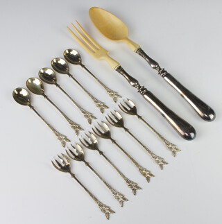Six white metal forks and five spoons 132 grams together with a pair of white metal handled servers 