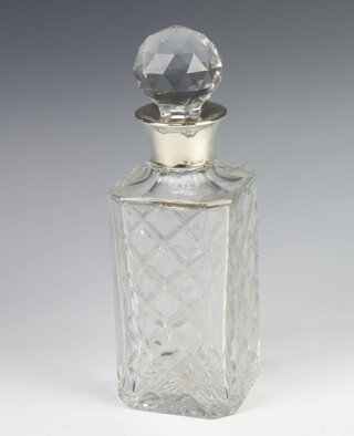 A cut glass spirit decanter and stopper with silver collar Birmingham 1967, 27cm 
