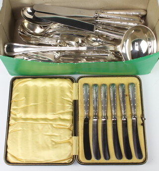 A set of silver plated ribbon and bow cutlery comprising 6 table knives, 6 soup spoons, 6 serving spoons, 5 teaspoons, a sifter spoon, 2 ladles, a pair of servers, a pair of fish servers, 6 fish knives and forks, marrow scoop, a pair of servers and a cased set of 6 silver handled butter knives