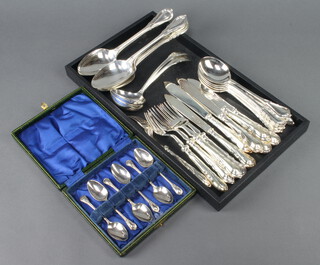 A set of silver plated lily pattern cutlery comprising 6 teaspoons, 6 soup spoons, 6 tablespoons, 2 ladles, 6 pairs of fish eaters