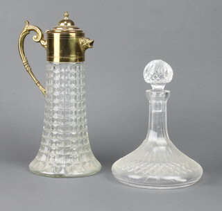 A moulded glass claret jug with gilt metal mount 35cm, a ships decanter 25cm 