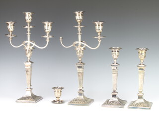 A set of 4 silver plated Elkington candlesticks of tapered form 25cm together with two three branch candle holders (one a/f) 