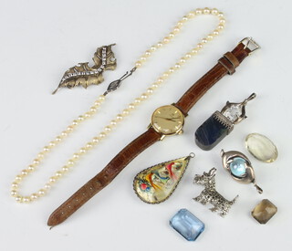 A string of cultured pearls with a silver clasp, a lady's wristwatch and minor jewellery