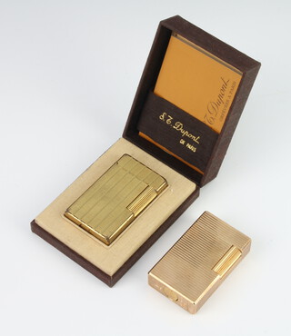 A gentleman's gilt Dupont cigarette lighter, a ditto boxed