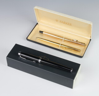 A black cased Parker ballpoint pen, a ditto gilt cased fountain pen and a ballpoint pen cased 