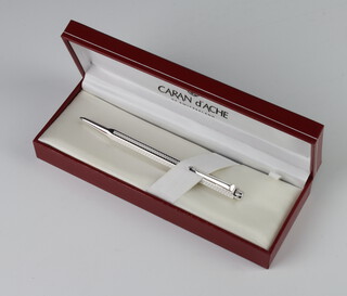 A Caran D'Ache white metal propelling pencil, cased 