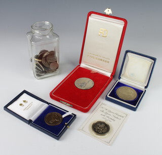 A Chinese white metal commemorative medallion Abu Dhabi Oil Company Ltd and minor coins and crowns 
