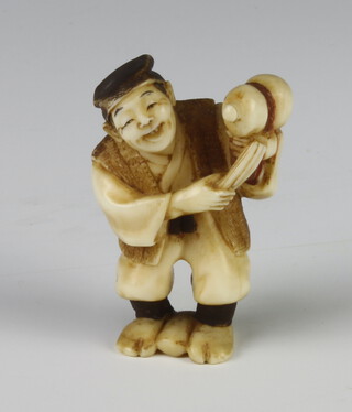 A Meiji Period Japanese carved ivory netsuke in the form of man holding a gourd, signed, 4cm 