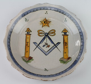 A 19th Century Delft plate decorated with Masonic symbols 23cm diam. 
