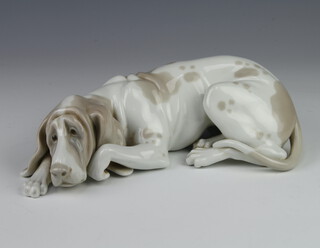 A Lladro figure of a reclining hound 24cm 