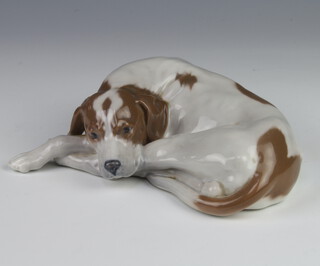 A Royal Copenhagen figure of a reclining hound with original label, 20cm  
