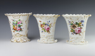 A trio of 19th Century vases decorated with spring flowers and gilt highlights 21cm and a pair 20cm 
