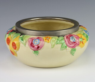 A Clarice Cliff moulded bowl decorated with flowers with a metal rim no.993, 22cm 