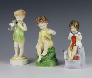 Three Royal Worcester figures - Friday's Child is Loving and Caring 15cm, Saturday's Child Works Hard for a Living 3062 14cm and Wednesday's Child Knows Little Woe 17cm 