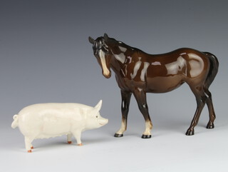 A Beswick Sow no.14528 modelled by Arthur Greddington 9.5cm and a Mare no.976 facing left, brown gloss, modelled by Arthur Greddington 17.2cm 