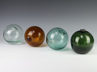 Four coloured glass fishing floats 