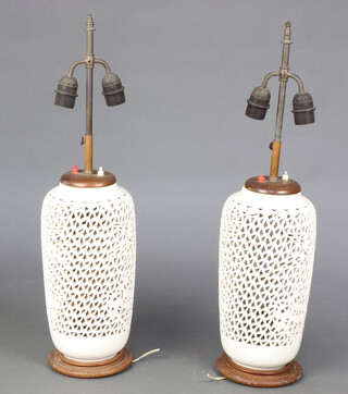 A pair of 20th Century Chinese white glazed reticulated table lamps 35cm 