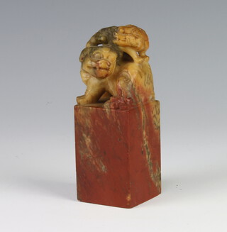 A late 19th Century carved soapstone seal in the form of a She She with pup on her back 11cm 