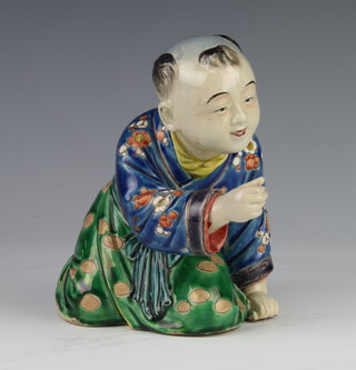 A late 19th Century Chinese figure of a kneeling boy raising his hand 15cm 