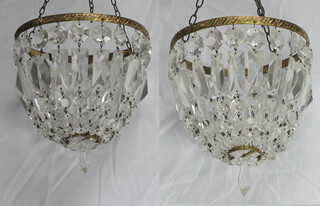 A pair of circular gilt metal and glass bag shaped light fittings 24cm h x 19cm diam. 