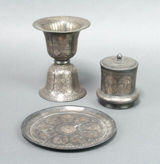 A "Persian" engraved metal bell shaped vase 15cm h x 11cm together with a cylindrical jar and cover 8cm x 7cm and a circular dish 17cm 