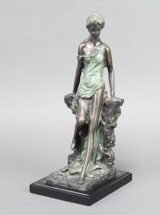 A 20th Century bronze figure of a standing lady raised on a square marble base 29cm h x 12cm x 15cm 
