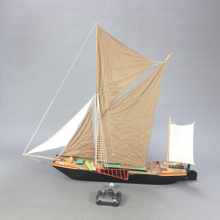 A radio controlled model of a fully rigged thames barge 118cm h x 127cm w x 23m d 