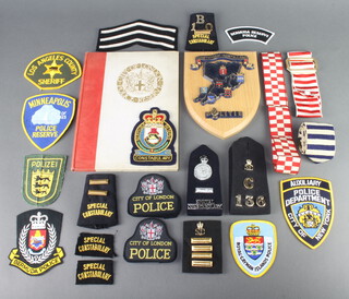 One volume "City of London Police Reserve, a Record 1914-1920", "City of London Police Duty Band", a "Police Duty Band" and various Special Constabulary and Police cloth insignia