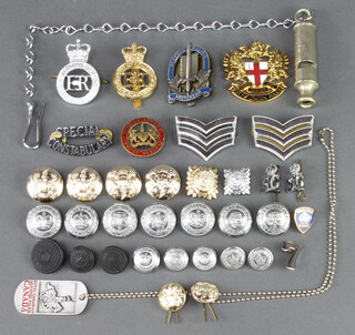 A City of London Police cap badge, an enamelled City of London Police reserve badge, ditto Special Constabulary cap badge and other badges 