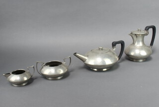 W Hutton Pewter for Liberty, a 4 piece planished pewter tea service comprising teapot, hot water jug and cream jug and sugar bowl, the base marked Hutton Sheffield English Pewter 04483 

