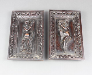 A pair of carved panels depicting figures of ladies playing instruments 6cm h x 26cm w x 42cm d