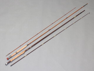 A Hardy Walker Superlite 9'8" 7/8 line weight fly fishing rod contained in a blue bag together with a Kerry of York 2 piece 6 line weight split cane fly rod with brown cloth bag  (2)