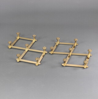 A pair of gilt metal expanding wall mounted coat hooks decorated Tudor roses 47cm x 33cm when opened