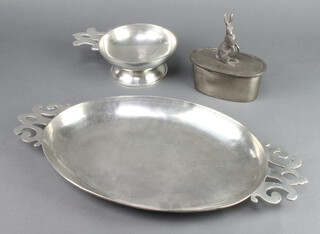 An oval pewter box lid decorated a standing hare 17cm x 12cm x 6cm, a Portuguese 17th Century style oval twin handled tray base marked Made in Portugal 3cm x 49cm w x 26cm d (some contact marks) and a ditto side handled bowl 7cm x 21cm 