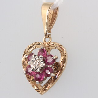 A 9ct yellow gold ruby and diamond pendant 1.6 grams, 20mm 