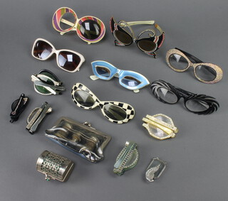 A pair of miniature gilt metal opera glasses, 6 pairs of folding spectacles, 7 other pairs and a pierced steel purse