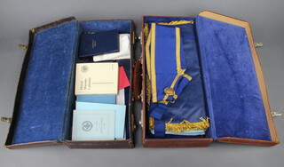 A quantity of Masonic regalia comprising Provincial Grand Officers full dress apron, Past Provincial Assistant Grand Director of Ceremonies Berkshire together with collar, a Master Masons apron and a quantity of books, contained in 2 leather cases 