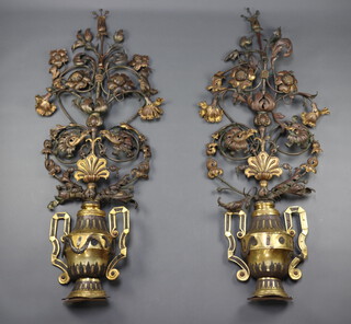 A pair of Italian style gilt and wrought metal furniture/wall embellishments  in the form of twin handled planted urns with swag decoration 166cm h x 62cm w 