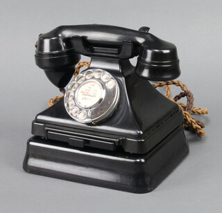 A black Bakelite dial telephone the base marked 1/232 C.B P L 46/1 complete with bell box 