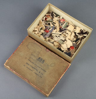 A rare Holtzapffel & Co wooden jigsaw puzzle, the interior of the lid marked 10 x 13 the puzzle depicting an interior scene with huntsman and boy with dog and puppies 