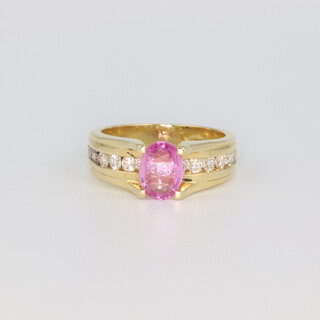 An 18ct yellow gold pink sapphire and diamond ring 7.6 grams, size M 