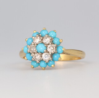 A yellow metal 18ct diamond and turquoise target ring, the centre turquoise 2mm surrounded by 6 brilliant cut diamonds each approx. 0.04ct surrounded by 12 turquoise 4.4 grams, size M 1/2 