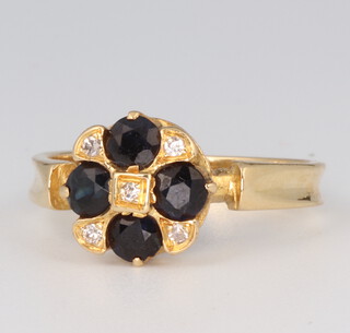 An 18ct yellow gold sapphire and diamond cluster ring 3.4 grams, size L 