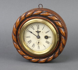 American Clock Co., a wall timepiece with 9cm paper dial, Roman numerals and subsidiary second hand contained in a carved beech case 5cm x 17cm 
