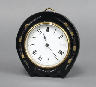 An Edwardian Continental timepiece with enamelled dial and Roman numerals contained in a carved ebony case in the form of a horseshoe 14cm x 13cm x 5cm 